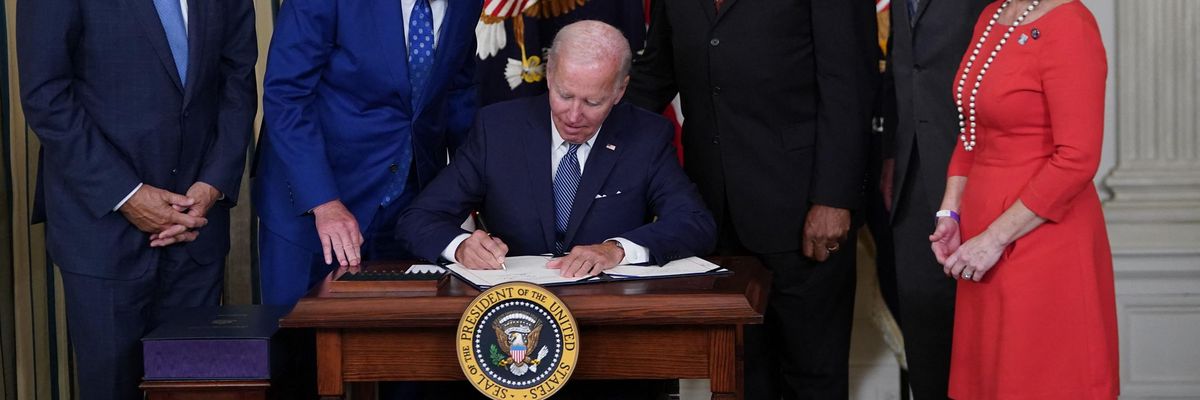 Biden signs IRA