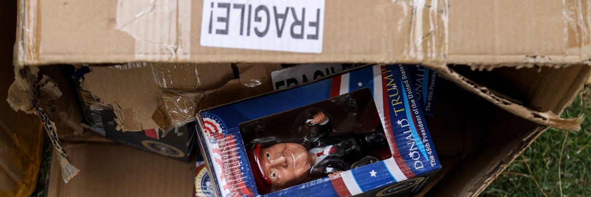 Bobblehead Trump in a box from China at his Las Vegas rally.