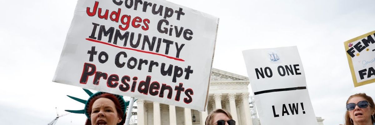 Demonstrators participate in a protest outside the U.S. Supreme Court