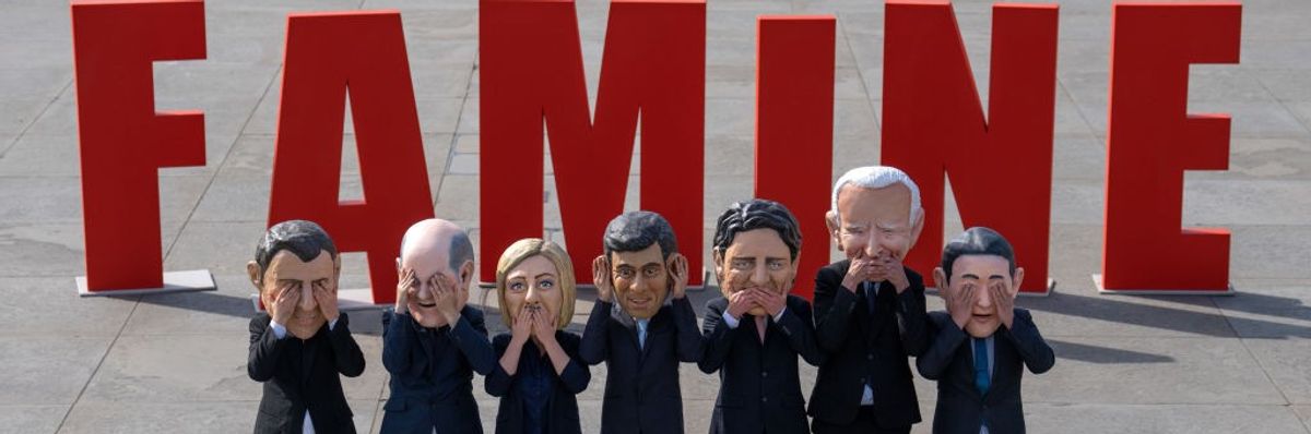 depictions of G7 leaders in front of 'FAMINE' 