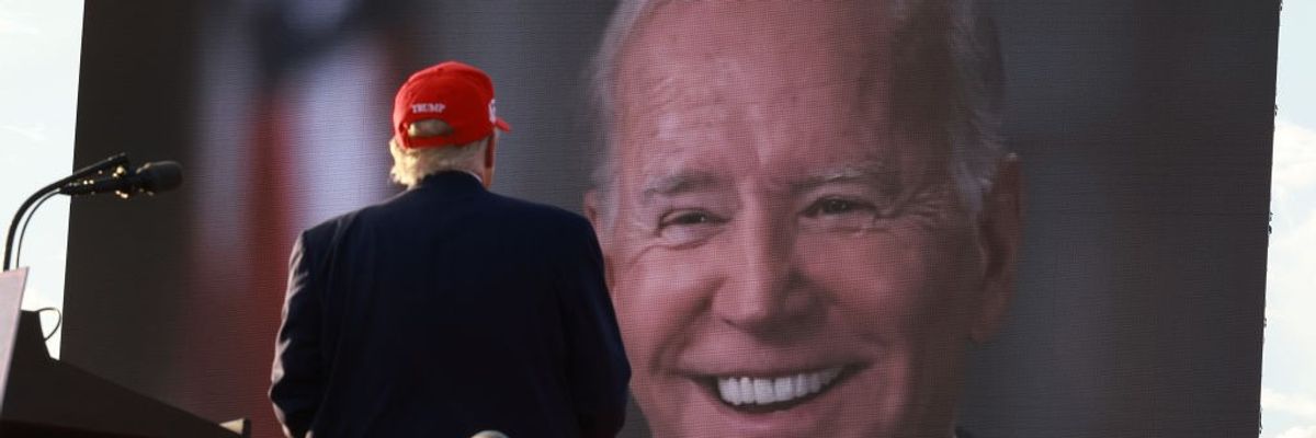Donald Trump watching picture of Joe Biden on large screen