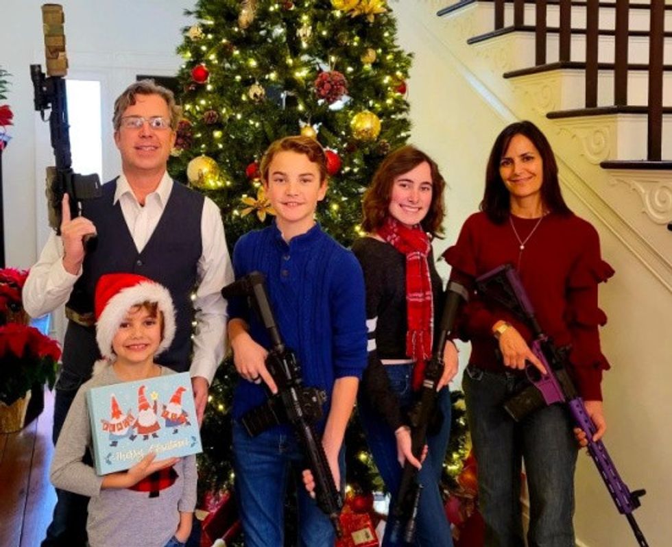  Last year's Christmas card from Tennessee GOP Rep. Andy Ogles shows him and his family all wielding assault rifles.