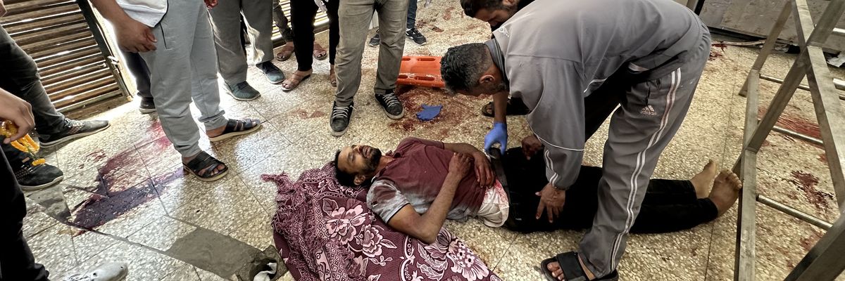 Man killed in Israel attack in Gaza lies on hospital floor.