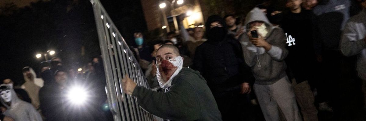 Member of pro-genocide mob throws fence
