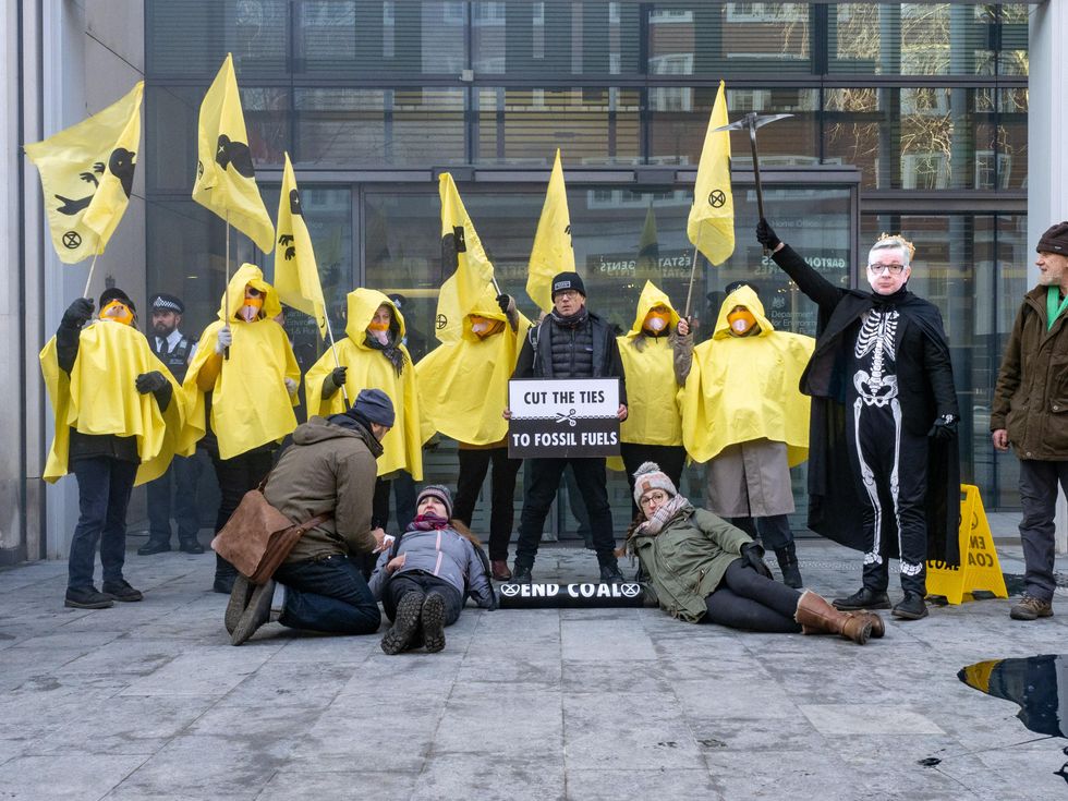 Members of Extinction Rebellion protested coal mining at the U.K. Department for Leveling Up, Housing, and Communities