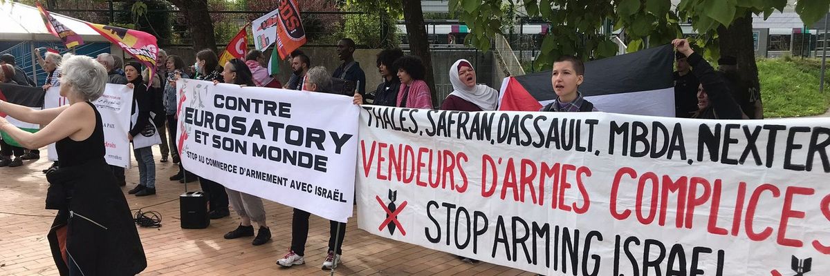 People protest arms sales to Israel outside the Eurosatory expo in Paris