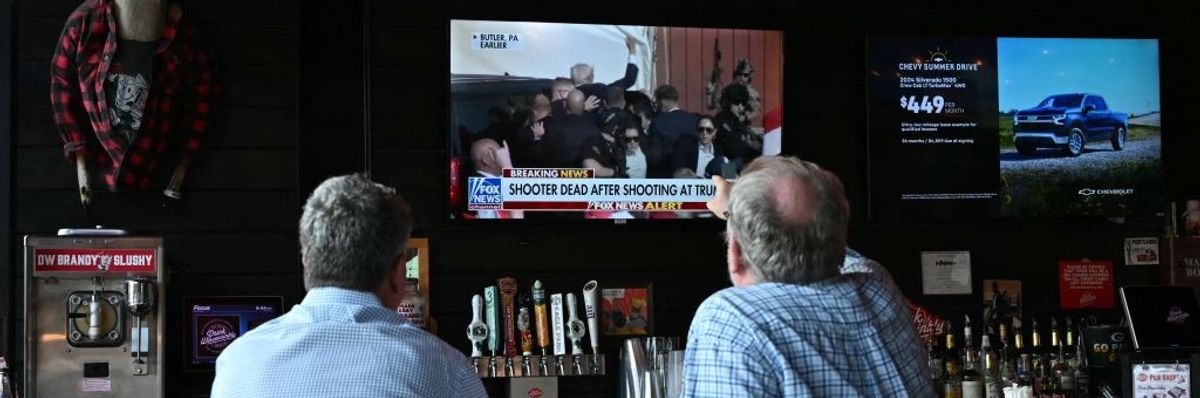 People watch news after Trump shot