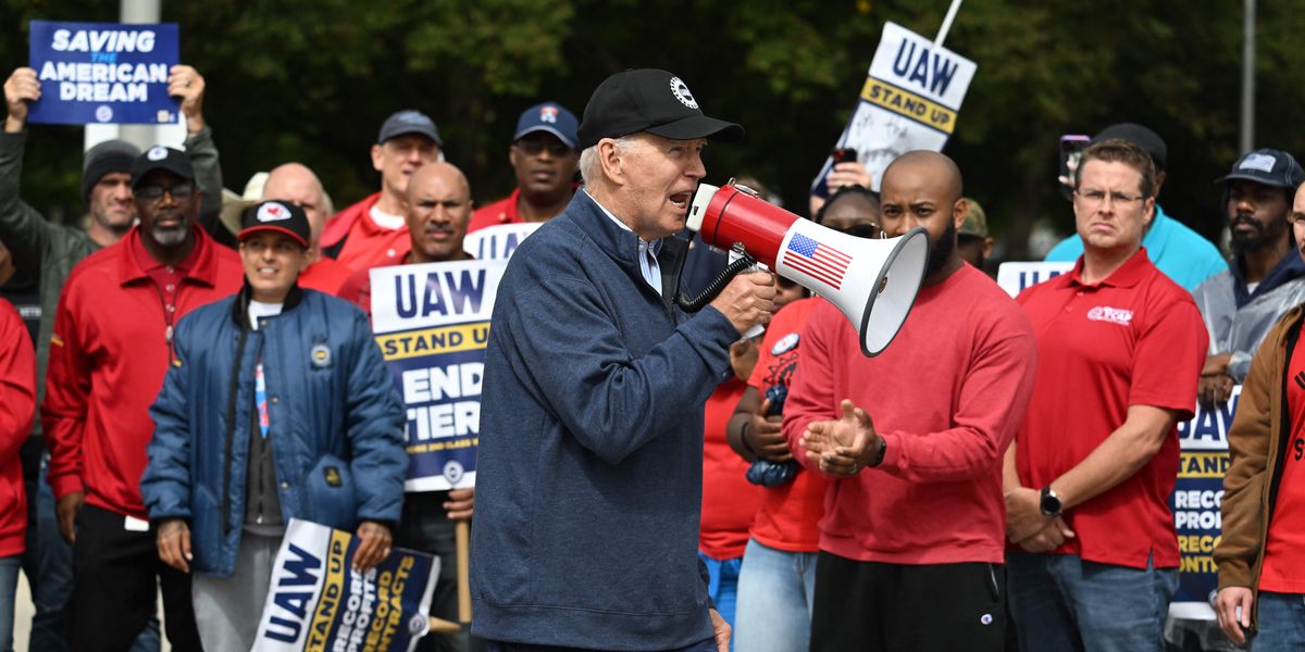 In Historic First, Biden Walks Picket Line With Striking UAW Workers