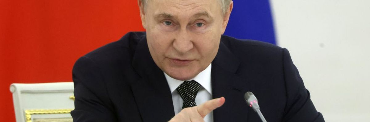Putin points his finger