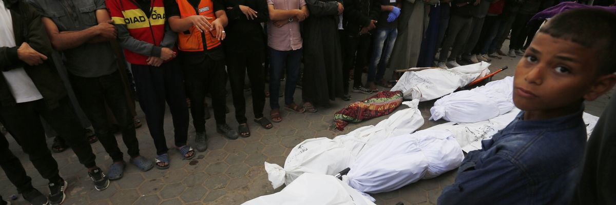 Relatives of Palestinians killed in an Israeli attack perform a funeral prayer