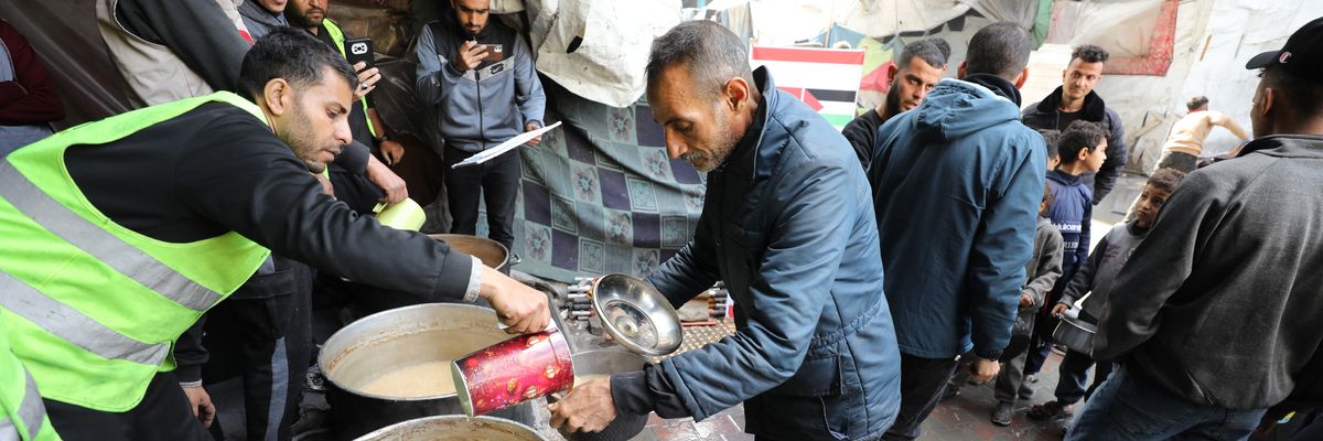 Relief workers distribute food in Gaza City