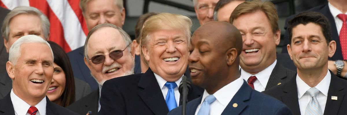 Republicans laugh with or at Tim Scott in 2017 after giving tax cuts to the rich