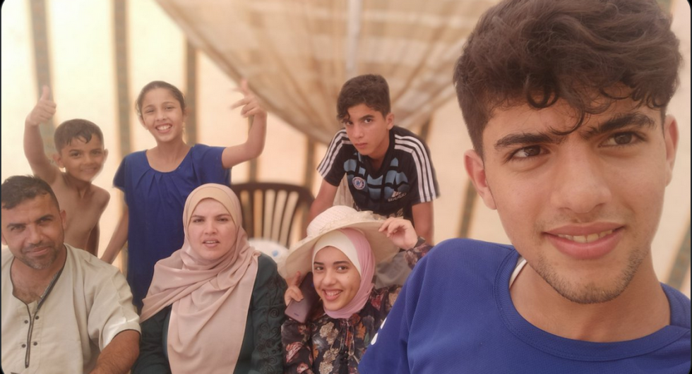 Sha\u2019ban Al Dalou with his family before the Israeli genocide began.