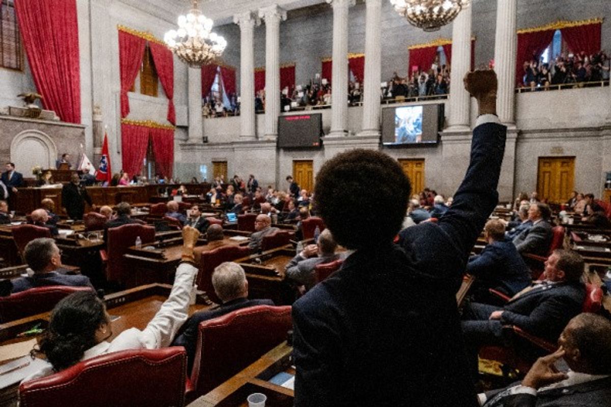 Tennessee Rep. Justin Pearson gives power salute to supporters in galley during the House vote to expel him