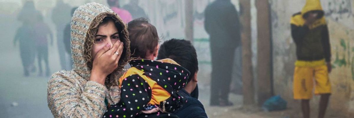 Women Holding child in Gaza