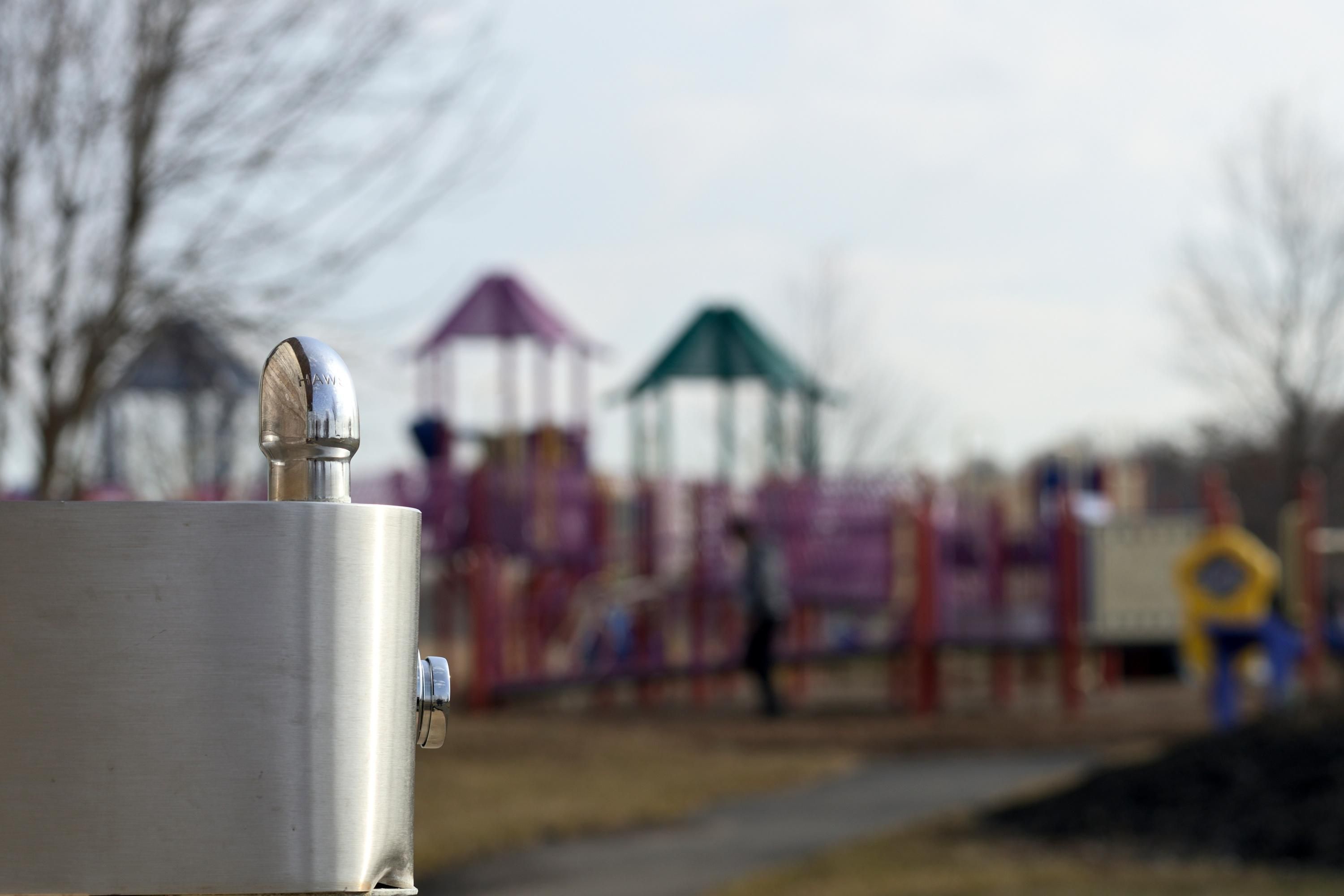 Playground with water fountain in foreground